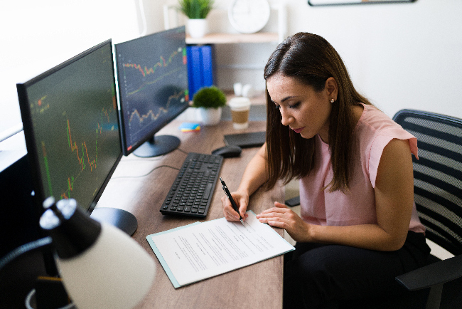 beautiful freelancer stock broker signing business deal her work desk successful businesswoman reading work contract